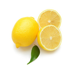 Whole and cut lemons on white background