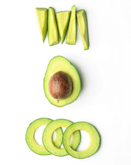 Composition with cut avocado on white background