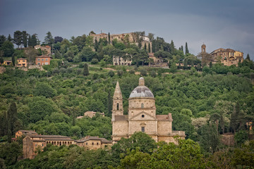 Fototapeta na wymiar Church of the Madonna di San Biagio at the gates of Montepulciano. View of the church Madonna di San Biagio and of the hilltop town of Montepulciano in Tuscany, Italy