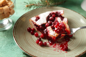 Piece of cranberry Christmas pie on fork over plate