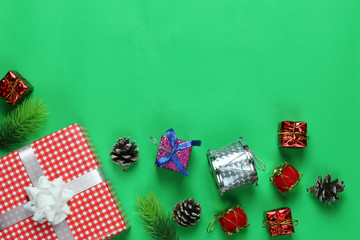Christmas Decoration on green art paper background and have copy space.