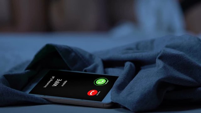 Incoming call from wife, husband cheating with mistress, betrayal, phone closeup