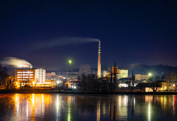 Fototapeta na wymiar A steel factory with smoke Very big building