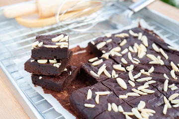 Dark chocolate brownies with almond topping.