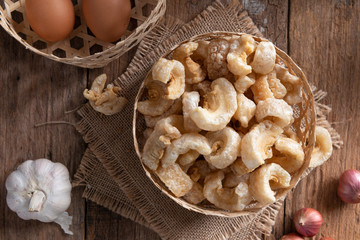 Pork rinds also known as chicharon or chicharrones , kab moo