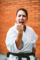 Woman who training karate with wheelchair