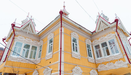 Carved wooden trim facade. Old historic house. Russian architecture. Chopped house with carved...