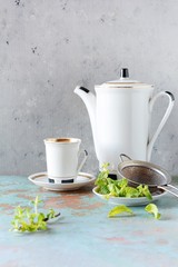 coffee set with fresh mint on gray background. Tasty drinks