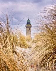 Leuchtturm zwischen Dünengras. Rostock, Deutschland © DR pics