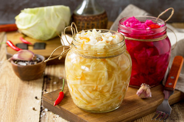 Sauerkraut variety preserving jars. Homemade Sauerkraut with Carrot and Salad Cabbage with Beetroot...
