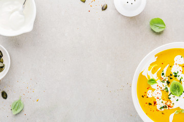 Pumpkin creamy soup served in bowl