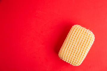 sponge with esparto to exfoliate in bathroom