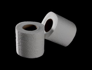 Toilet paper roll isolated on black background with clipping path