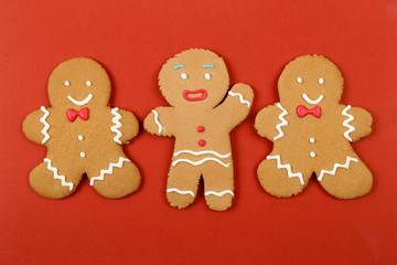  Christmas cookies, gingerbread In the form of a man on red background. Christmas background