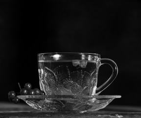 hot viburnum tea in a transparent cup with a handle