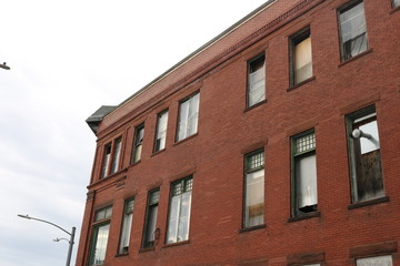 Boarded up abandoned brick industrial building