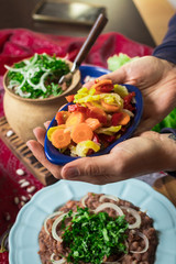 Lobio - traditional Georgian dish with red beans, cilantro, ajika spice served with pickles vegetables. Vegan vegetarian healthy food