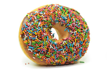 Fototapeta na wymiar Sweet donut with rainbow candy sprinkles