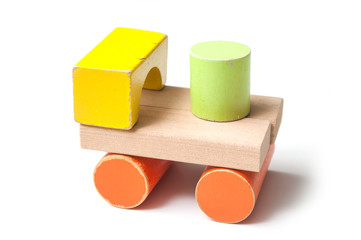 closeup of tractor on colorful wooden blocks on white background