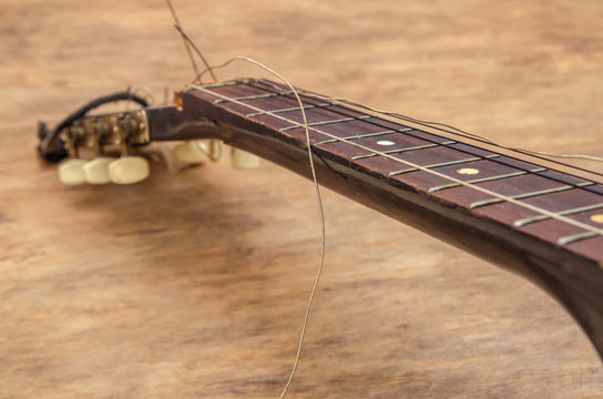 Broken guitar strings, guitar repair