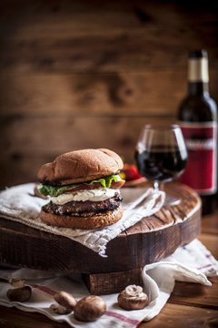 A Goat Cheese Burger with a Glass of Wine