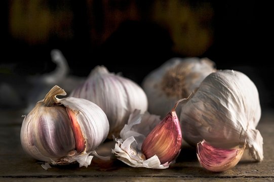 Pink garlic on a wooden surface