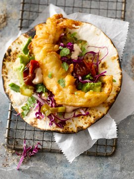 Tilapia taco with roasted tomatoes, avocado, red cabbage, jalape&ntilde;os and coriander (Mexico)