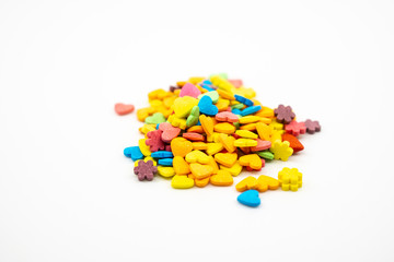 Sprinkle cake decoration on white background.