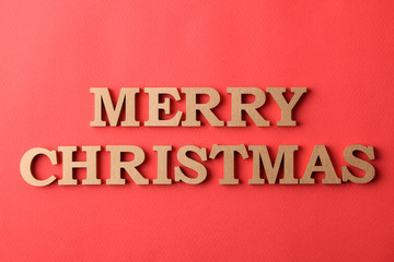 inscription Merry Christmas. gold letters on a red background. holidays. Christmas.