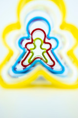 Cookie cutter gingerbread on white background.