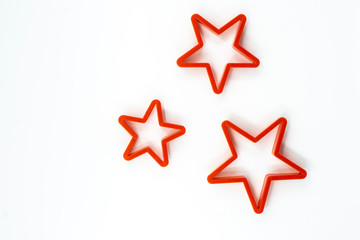 Cookie cutter star shape on white background