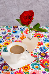 Coffee cup ond beautiful rose