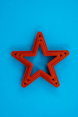 Cookie cutter star shape on blue background
