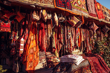 Fototapeta na wymiar Amazing traditional handmade turkish carpets in souvenir shop.