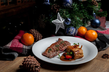 Fototapeta na wymiar Steak with mushrooms, New Year's menu
