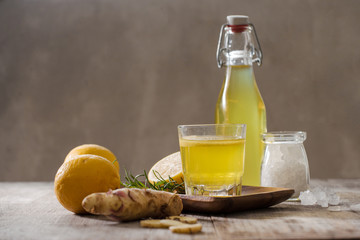 Homemade lemon and ginger organic probiotic drink, copy space.