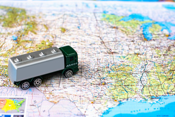 Miniature truck on a road map. Concept for visualization of delivery services, logistics,...