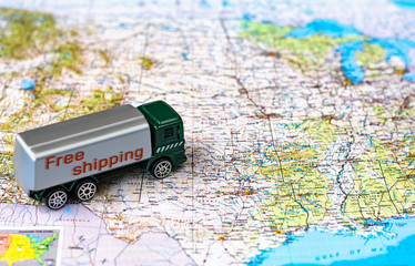 Miniature truck on a road map. Concept for visualization of delivery services, logistics,...