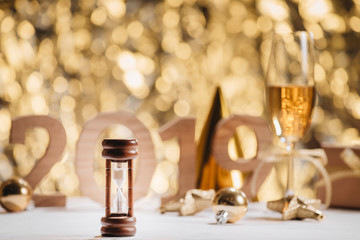 New Years Eve celebration background with pair of flutes, bottle of champagne