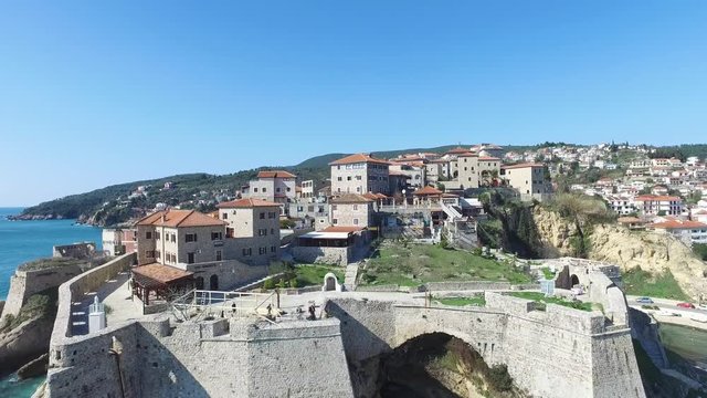 Ulcinj mone negro aerial skyline view fly over old town castle.