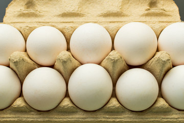 white chicken eggs in a package close-up