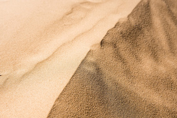 Fototapeta na wymiar Texture of sand dune in desert close background
