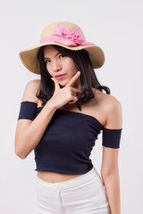 happy confident woman wearing summer travel hat. portrait of positive optimistic woman traveller, studio white isolated with holiday or vacation concept. young adult beautiful girl asian woman model