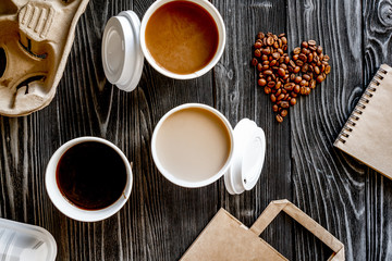 coffee cup take away at wooden background top view