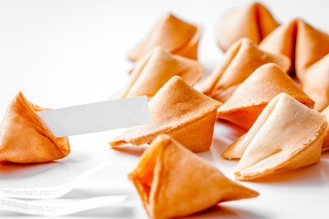 Chinese fortune cookie with prediction on white background