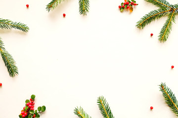Christmas mood concept. Layout composition with traditional festive attributes, green decorative fresh pine tree branches. Winter holidays season. Background, copy space, close up, top view, flat lay.
