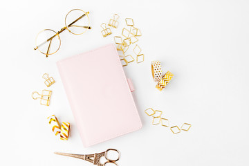 Pink planner with Business Stationery concept. Flat lay, top view