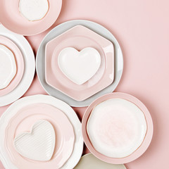 Plates and dishes for serving a festive table on pastel colors background. Flat lay, top view.