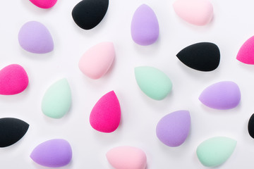 Pattern made of colorful beauty blenders. Flat lay