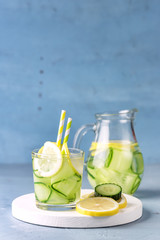 Glass of Detox Infused Water with Cucumber and Lemon Healthy Refreshing Drink vertical